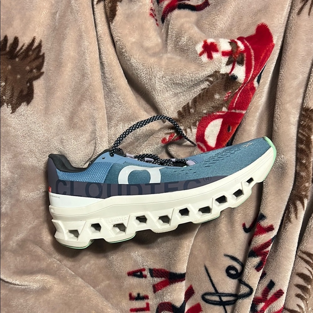 On Running Blue and White Athletic Shoes with Cushioned Sole